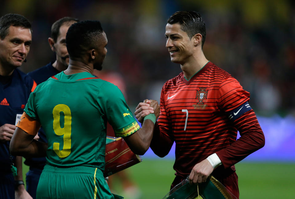 Portugal's Cristiano Ronaldo, right, shakes hands with Cameroon's Samuel Eto'o before their friendly soccer match Wednesday, March 5 2014, in Leiria, Portugal. The game is part of both teams' preparation for the World Cup in Brazil. (AP Photo/Armando Franca)