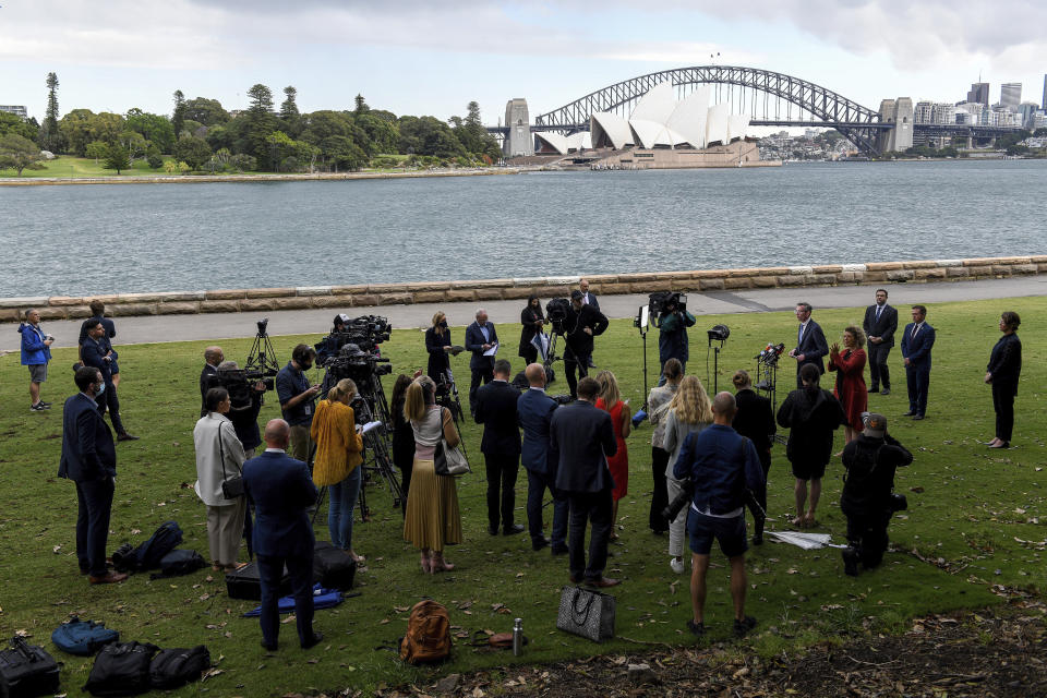 New South Wales Premier Dominic Perrottet speaks to the media during a press conference in Sydney, Friday, Oct. 15, 2021. Perrottet says the most populous state would end hotel quarantine for vaccinated international travelers as the government accelerates the wind back of pandemic restrictions. (AAP Image/Bianca De Marchi)