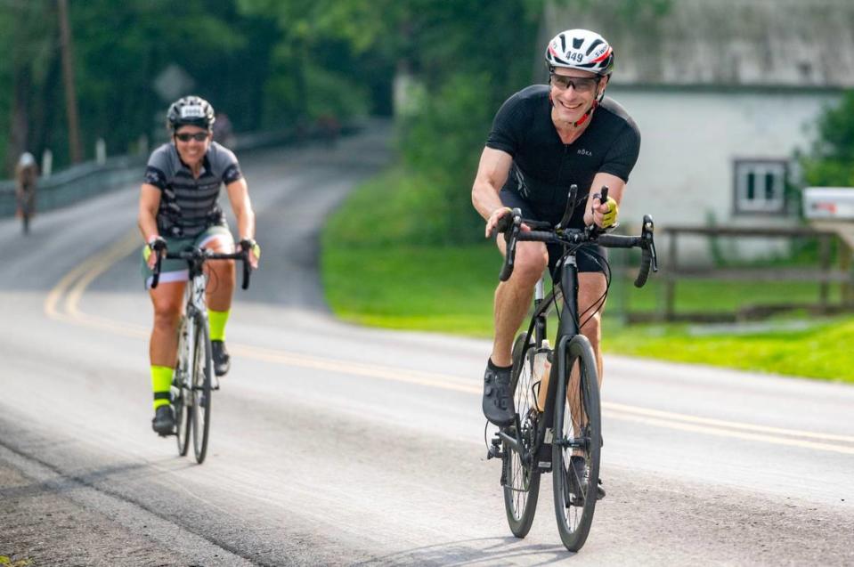 State College mayor Ezra Nanes rides along Jacksonville Road during 56 mile bike ride for the Ironman 70.3 Pennsylvania Happy Valley on Sunday, June 30, 2024.