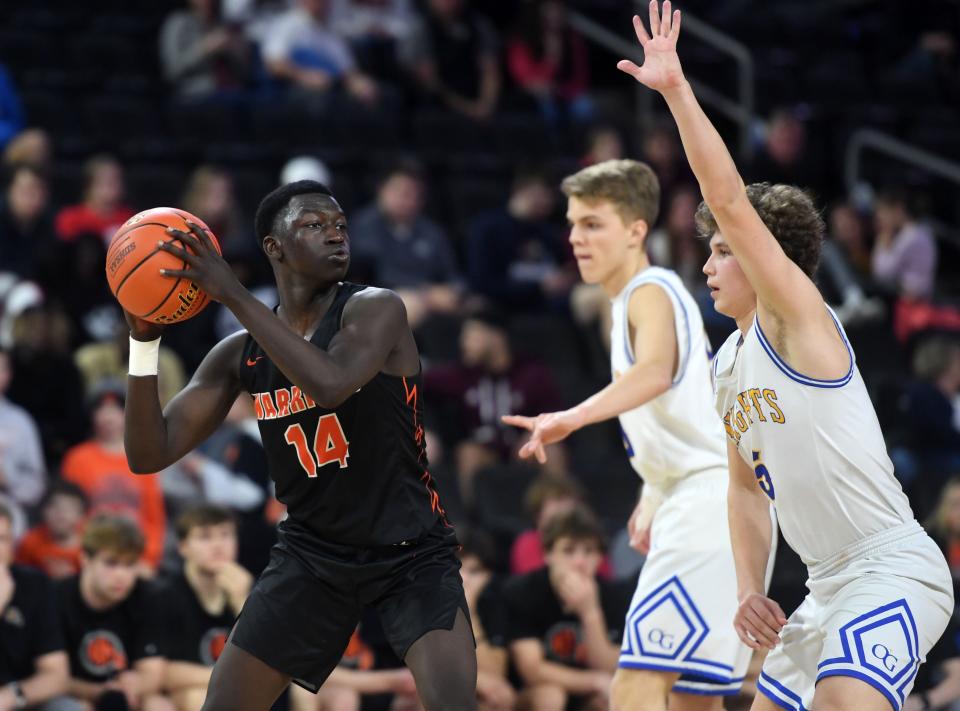 Washington's Mandalla Mohamed keeps the ball from O'Gorman's defense in the class AA boys basketball semifinals on Friday, March 17, 2022, at the Denny Sanford Premier Center in Sioux Falls.