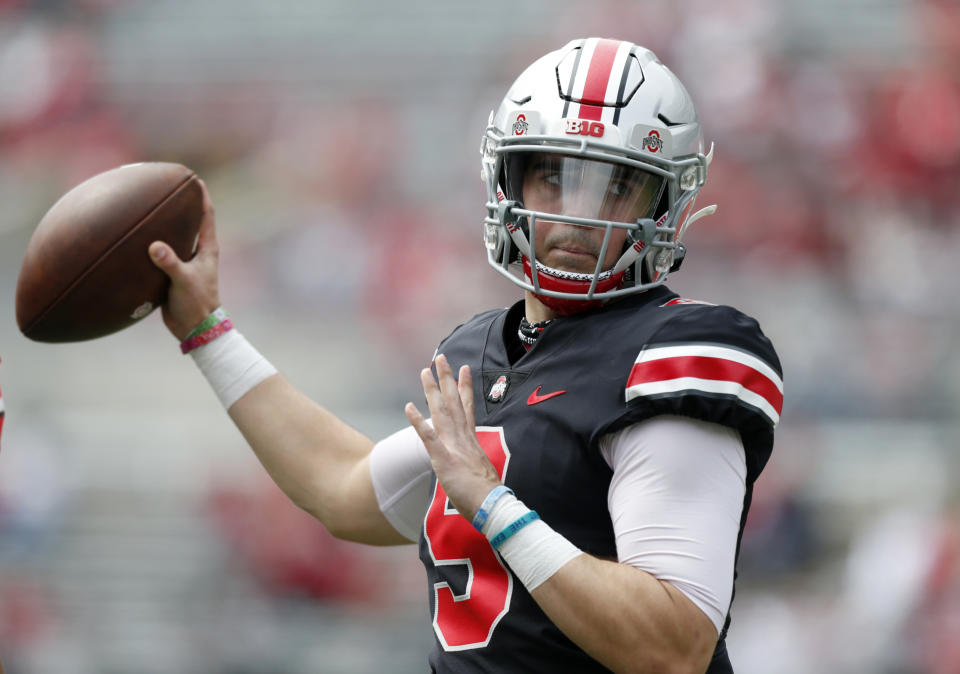 FILE - Ohio State quarterback Jack Miller throws on the sideline during an NCAA college spring football game in Columbus, Ohio, in this Saturday, April 17, 2021, file photo. With two-time Big Ten player of the year Justin Fields departing for the NFL, returning backups C.J. Stroud and Jack Miller III and five-star January enrollee Kyle McCord took the snaps in spring practice. Stroud was believed to be the front-runner entering the spring, but coach Ryan Day said a starter might not be determined until the week of the Sept. 2 opener at Minnesota.(AP Photo/Paul Vernon, File)
