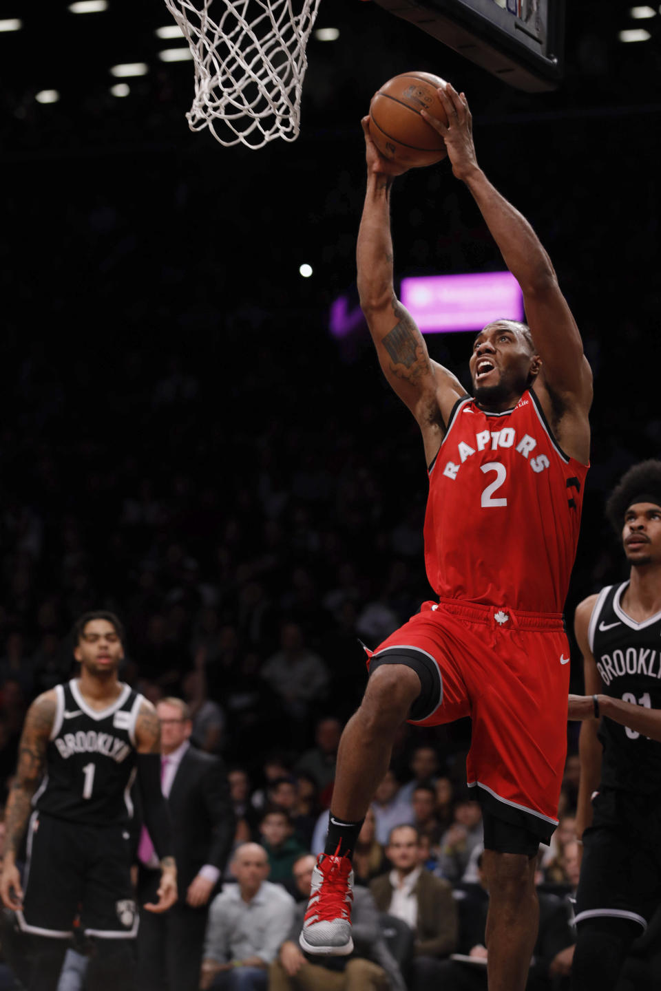 Toronto Raptors forward Kawhi Leonard goes up for a dunk during the first half of the NBA basketball game against the Brooklyn Nets, Wednesday, April 3, 2019, in New York. (AP Photo/Kevin Hagen)