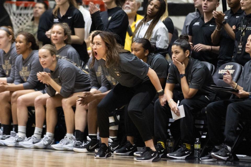 Army coach Missy Traversi shouts instructions from the bench during Saturday's game with Navy. ALLYSE PULLIAM/For the Times Herald-Record