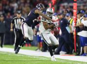 <p>Oakland Raiders receiver Amari Cooper (89) has a pass broken up by Houston Texans cornerback A.J. Bouye (21) in the third quarter in the AFC Wild Card playoff football game at NRG Stadium. Mandatory Credit: Matthew Emmons-USA TODAY Sports </p>