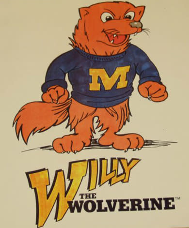 A cartoon depiction of one-time mascot "Willy the Wolverine," a wolf-like creature standing on two legs and sporting a dark blue sweater with Michigan's "Block M" in maize.