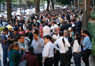 <p>People stand along Reforma Avenue after a 7.2-magnitude earthquake shook Mexico City, Friday, Feb. 16, 2018. (Photo: Marco Ugarte/AP) </p>