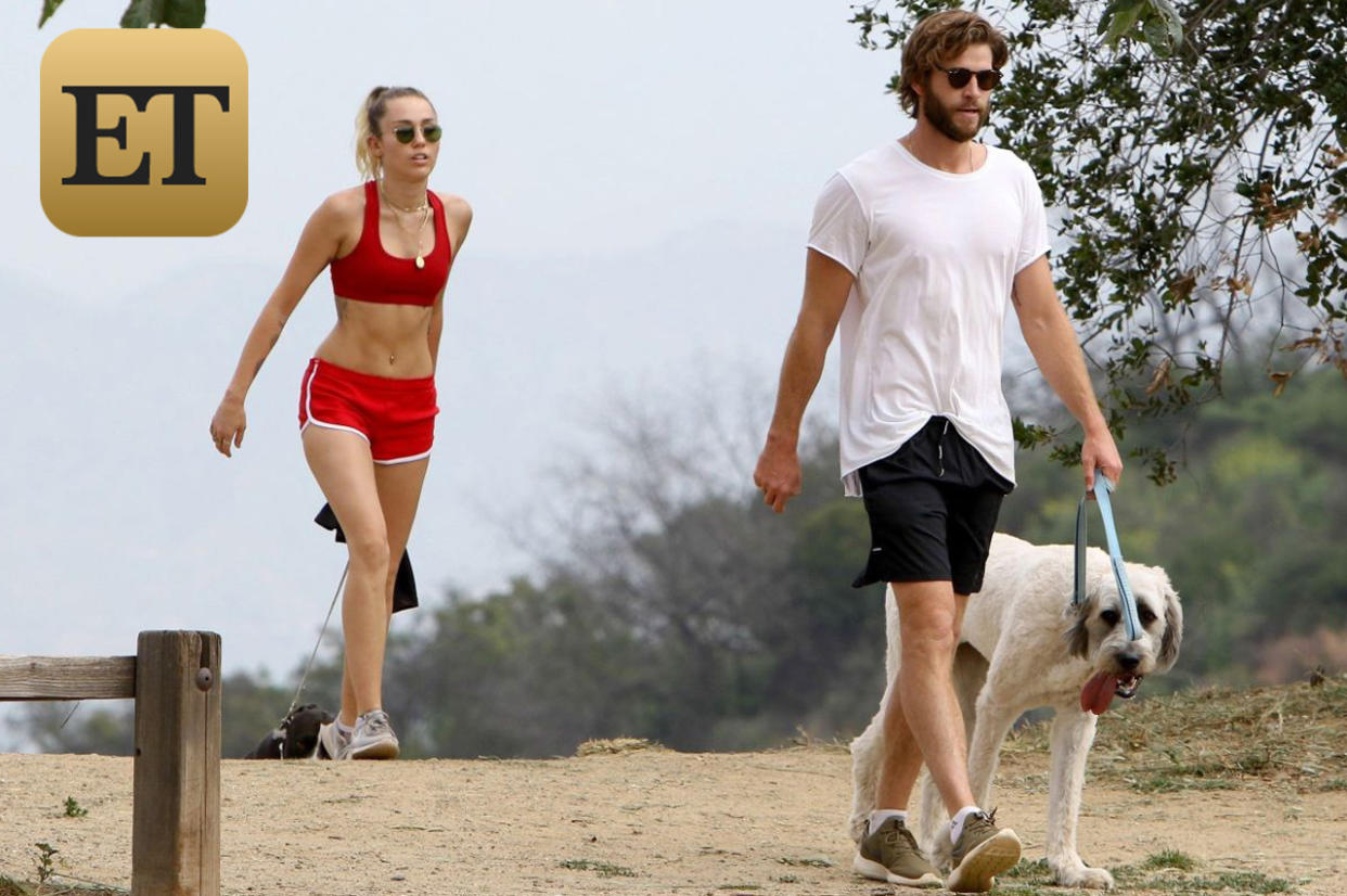 AG_808811 -  - *EXCLUSIVE* Los Angeles, CA - Miley Cyrus and Liam Hemsworth keep their bodies in shape by taking their dogs for a hike. Miley looked very fit and healthy showing off her abs in a red sports bra and matching red short shorts. Liam opted for a casual look with a plain white tee and navy board shorts. The couple shielded their eyes with sunglasses and looked to be finishing their hike as they were seen getting into their Range Rover to leave.Pictured: Miley Cyrus, Liam HemsworthAKM-GSI 6 APRIL 2017BYLINE MUST READ: LESE / AKM-GSI Maria Buda(917) 242-1505mbuda@akmgsi.com Mark Satter(317) 691-9592msatter@akmgsi.com or sales@akmgsi.com