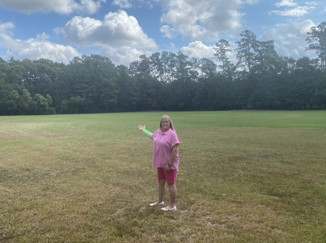 Peggy Jones in a grassy field.