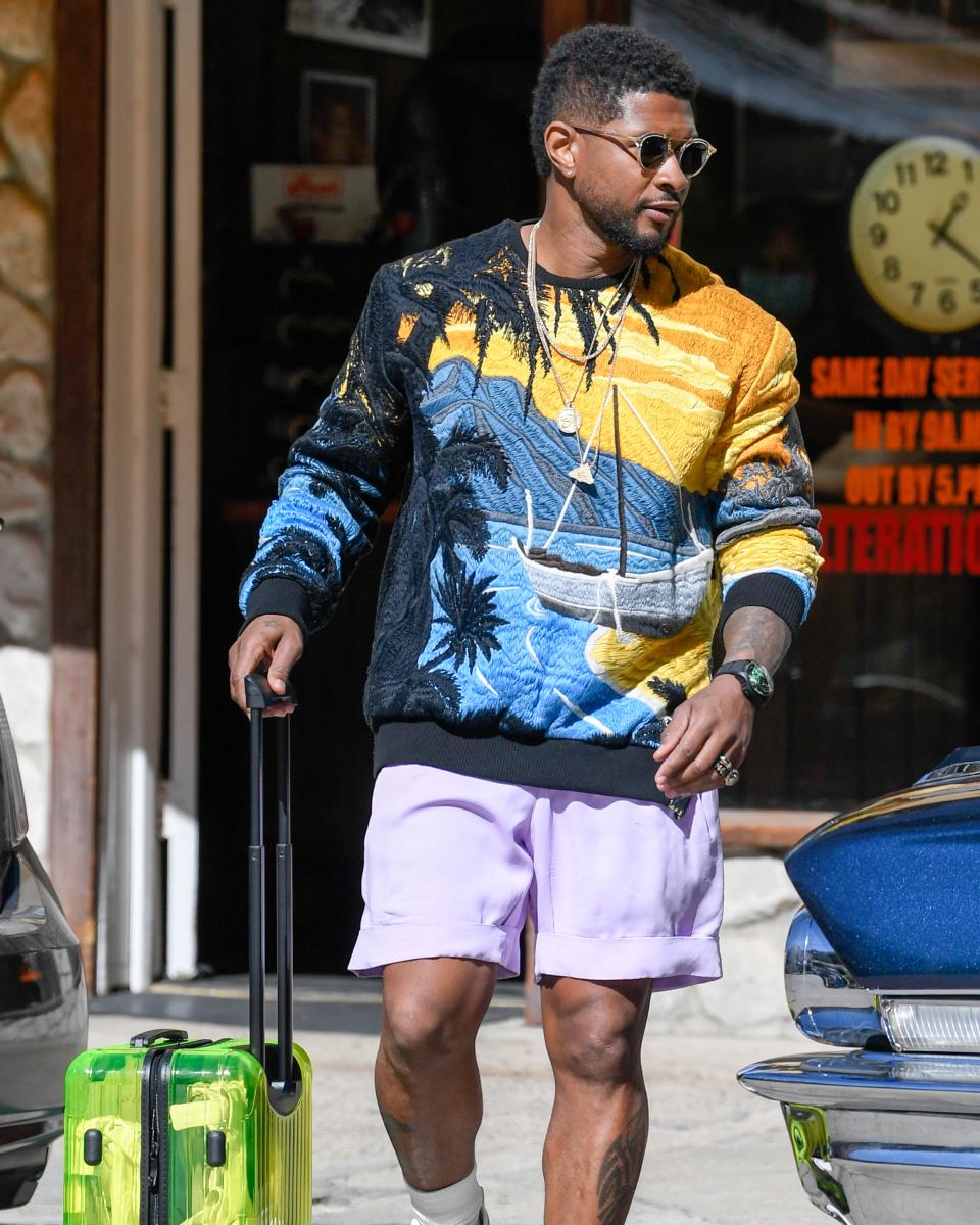 Usher Raymond is seen leaving a dry cleaners