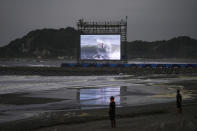 Lifeguards stand on the beach during the surfing competition at the 2020 Summer Olympics, Monday, July 26, 2021, at Tsurigasaki beach in Ichinomiya, Japan. The Olympic beach party that never was may be the only sore spot for surfing’s long-awaited debut that finished triumphantly this week. (AP Photo/Francisco Seco)
