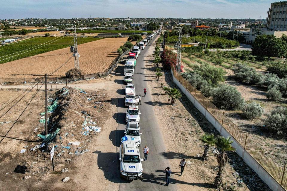 A convoy of humanitarian aid trucks arrives in Gaza via the Rafah border crossing through Egypt on 21 October (AFP via Getty Images)