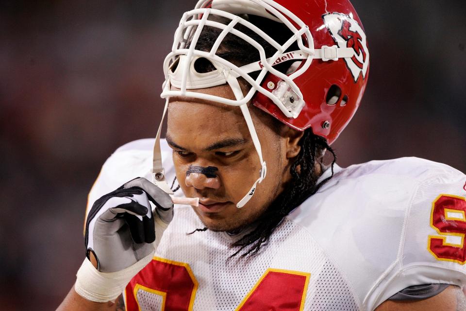 DENVER - SEPTEMBER 26:  Defensive tackle Junior Siavii #94 of the Kansas City Chiefs uses smelling salts before a game against the Denver Broncos September 26, 2005 at Invesco Field at Mile High stadium in Denver, Colorado. The Broncos won 30-10.  (Photo by Brian Bahr/Getty Images)