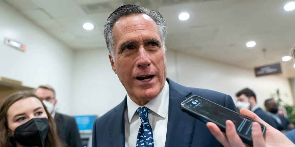 Sen. Mitt Romney, R-Utah, talks to reporters during votes, at the Capitol in Washington, Tuesday, Feb. 15, 2022.