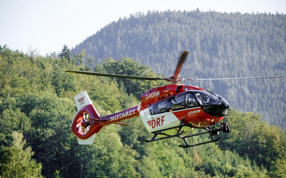 A DRF helicopter with German police officers is searching for a man armed with knives and pistols in a forest area north of Oppenau near Offenburg -  RONALD WITTEK/EPA-EFE/Shutterstock/Shutterstock