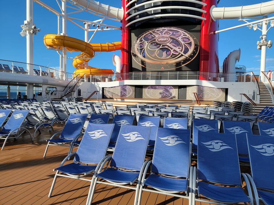 deck chairs and waterslide on a disney wish cruise ship