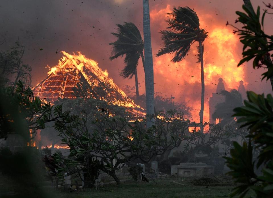 The hall of historic Waiola Church in Lahaina and nearby Lahaina Hongwanji Mission are engulfed in flames along Wainee Street (AP)