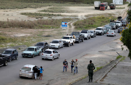 Venezuelans are pictured on the border with Brazil, as seen from the Brazilian city of Pacaraima, Roraima state, Brazil February 21, 2019. REUTERS/Ricardo Moraes