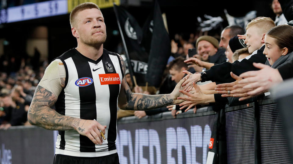 Jordan de Goey hi-fives Collingwood fans.