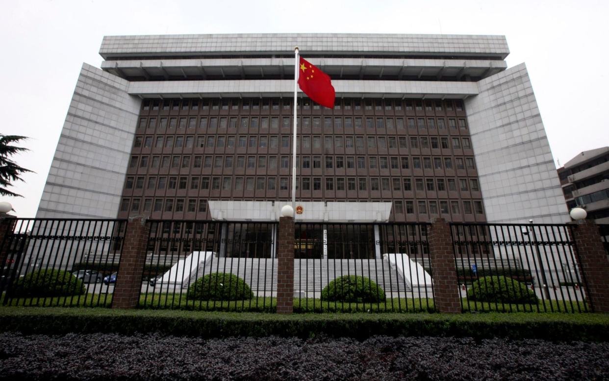 China flag court - AP Photo/Eugene Hoshiko