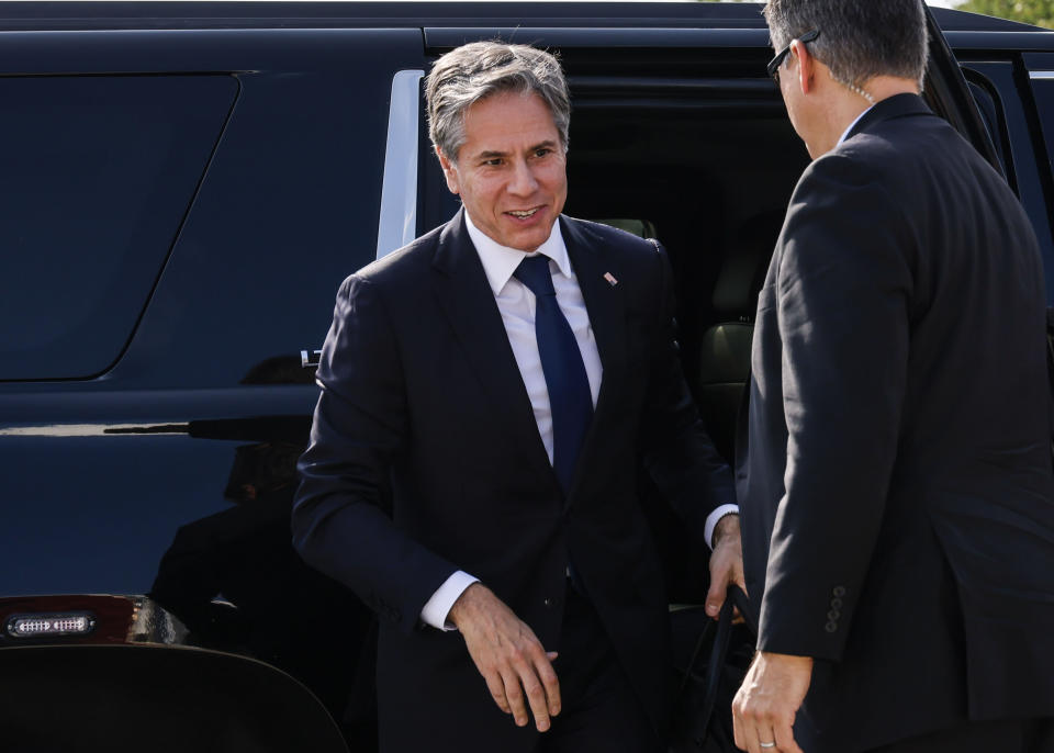 Secretary of State Antony Blinken, left, arrives to board a plane, Monday, July 26, 2021 at Andrews Air Force Base, Md., traveling to New Delhi, India and Kuwait City, Kuwait. (Jonathan Ernst/Pool via AP)