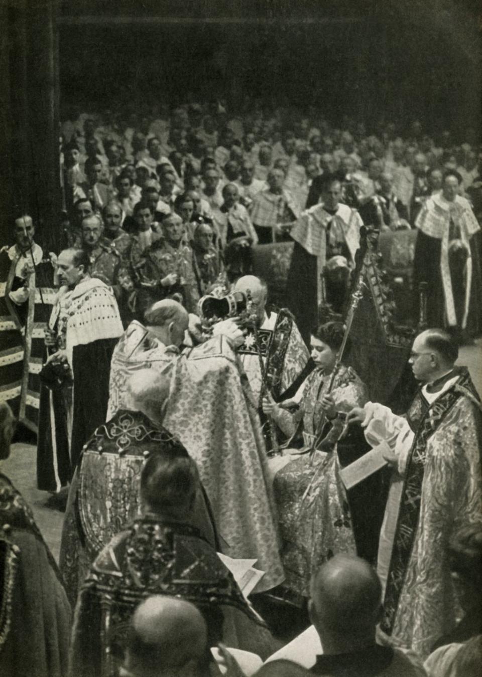 the coronation of her majesty queen elizabeth ii, 2nd june, 1953, 1962 the queen, seated in king edwards chair, is crowned by geoffrey fisher, archbishop of canterbury, in westminster abbey st edwards crown, only used for the actual moment of coronation, is placed on her head from the crown jewels in the tower of london, by martin holmes, fsa her majestys stationery, london, 1962 creator unknown photo by the print collectorheritage images via getty images