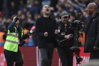 Manchester City's head coach Pep Guardiola celebrates on full time of the English FA Cup semifinal soccer match between Manchester City and Chelsea at Wembley stadium in London, Saturday, April 20, 2024. Manchester City won 1-0. (AP Photo/Ian Walton)