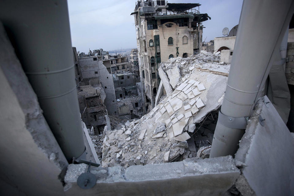 FILE - In this Thursday, Nov. 29, 2012 file photo, destroyed buildings, including the Dar Al-Shifa hospital, bottom, lay in ruins following airstrikes in Aleppo, Syria, in this file photo dated Thursday, Nov. 29, 2012. In the summer of 2012 fighting spread to the former commercial capital, Syria's largest city Aleppo, with rebel forces controlling some neighborhoods, but the battle for overall control continues to this day and much of the city lays in ruins. (AP Photo/Narciso Contreras, File)