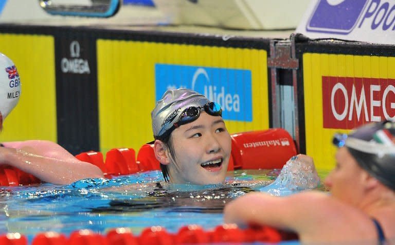 Ye Shiwen (C) of China celebrates her gold medal in the women 200m individual medley final during the FINA World Short Course Swimming Championships in Istanbul on December 15, 2012