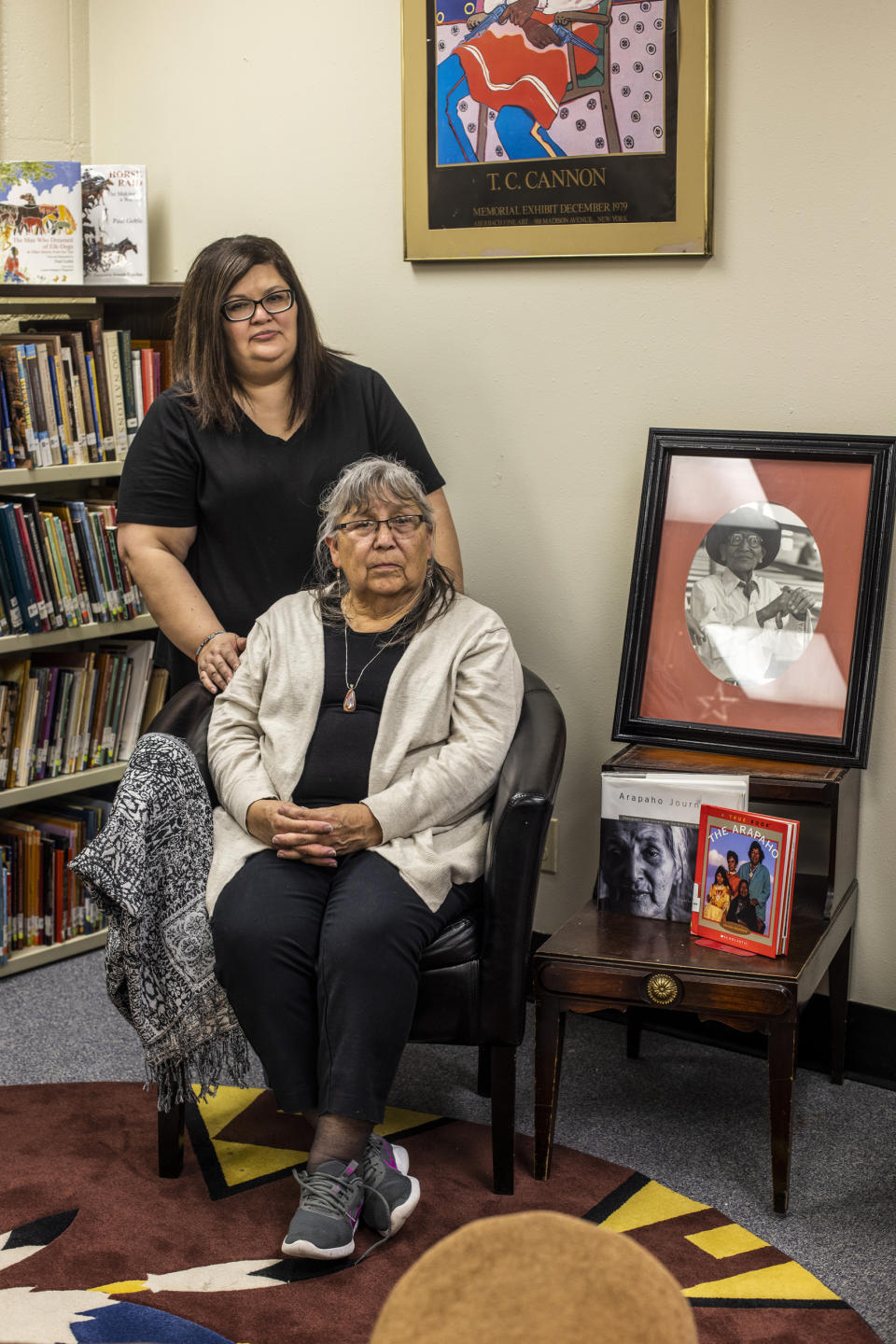 Gloria Runs Close To Lodge-Goggles in the indigenous section of the library with her daughter Jennifer Runs Close To Lodge at the Wyoming Indian Middle School in Ethete, Wy., on April 26, 2022. (Natalie Behring for NBC News)