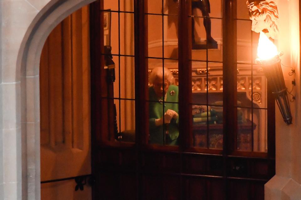 The Queen waits before heading out to light the beacon at Windsor Castle (Reuters)