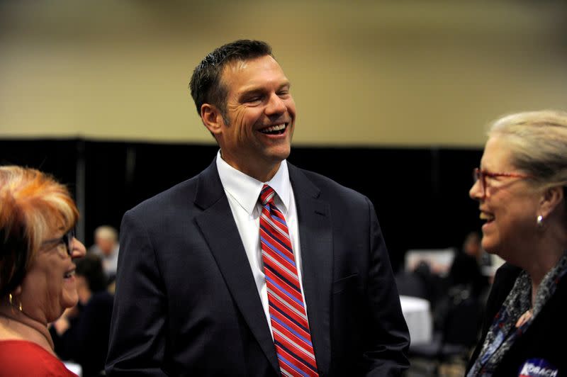 FILE PHOTO: Republican gubernatorial candidate Kris Kobach greets supporters at his election night party in Topeka