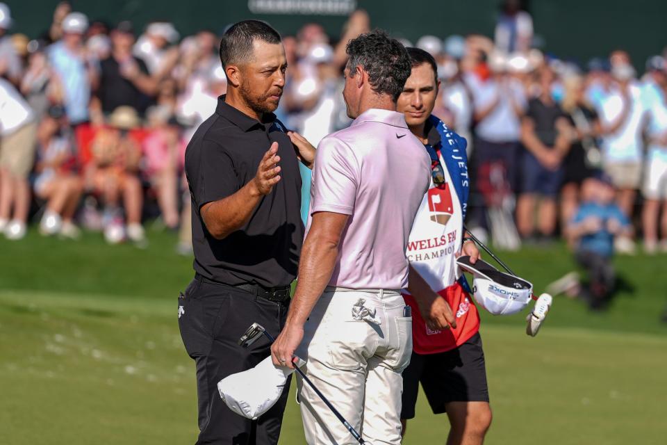 Rory McIlroy and Xander Schauffele shake hands at the end of the final round of the 2024 Wells Fargo Championship. (Photo: Jim Dedmon-USA TODAY Sports)