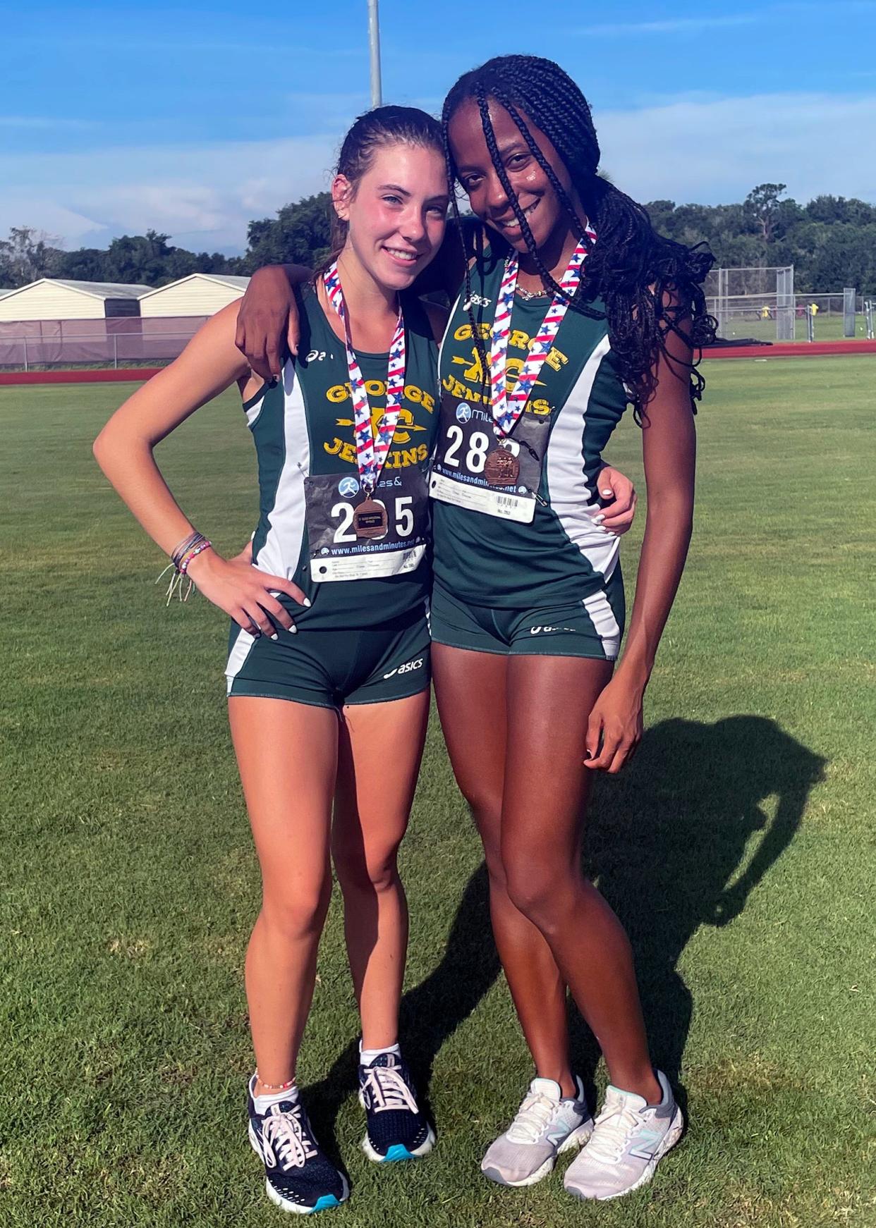 George Jenkins' Payton Rusk, left, finished fourth, and Jaade McBridge, right, finished third to lead George Jenkins to the team title at the St. Cloud Invitational.