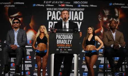 Jan 21, 2016; New York, NY, USA; Boxing trainer Teddy Atlas (middle) speaks during a press conference at Madison Square Garden to announce the upcoming boxing fight between Manny Pacquiao (left) and Timothy Bradley, Jr. (right) to be held on April 9 in Las Vegas. Mandatory Credit: Noah K. Murray-USA TODAY Sports