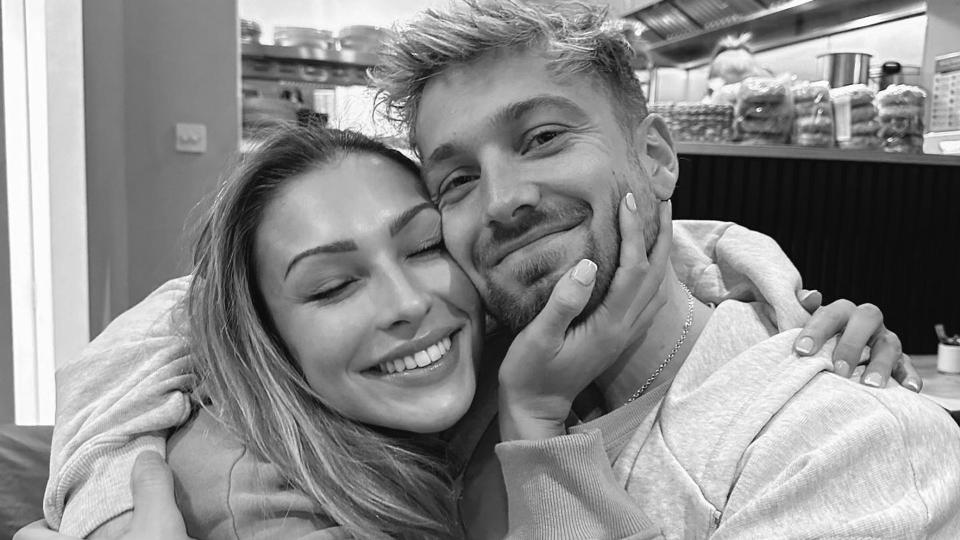 Zara McDermott and Sam Thompson cuddling in black and white