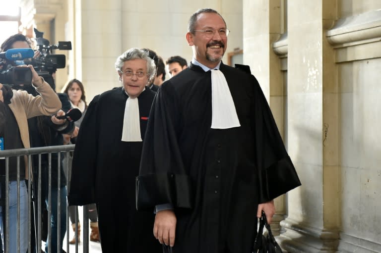 Lawyer for the French General Directorate of Public Finance, Xavier Normand Bodard (L), and lawyer of Franco-American art-dealer Guy Wildenstein, Eric Dezeuze, arrive at the Paris courthouse on January 4, 2016