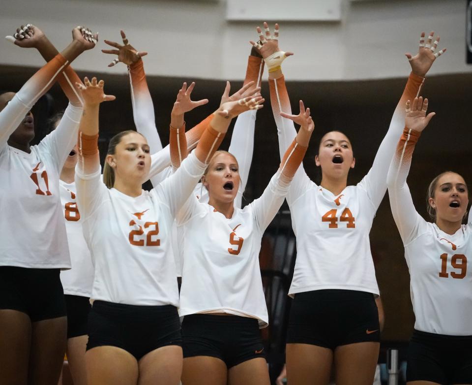 University of Texas players celebrate a point during their Sept. 28 win over BYU in Gregory Gymnasium. The Longhorns, who won last year's NCAA volleyball championship, repeated with the program's fifth national title Dec. 17 and should be in line to contend for a third straight title in 2024.