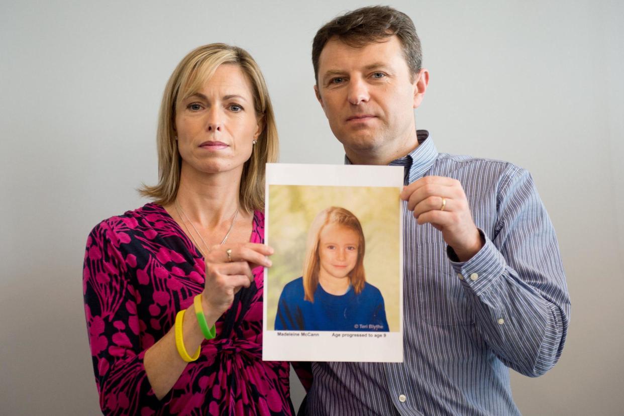 Hope: Parents Kate and Gerry McCann in 2012 with an artist's impression of how their daughter would look age nine: AFP/Getty Images