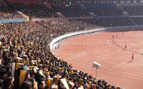 The race started off in a packed stadium with thousands of spectators engaged in choreographed cheering - Credit: Olympic Channel