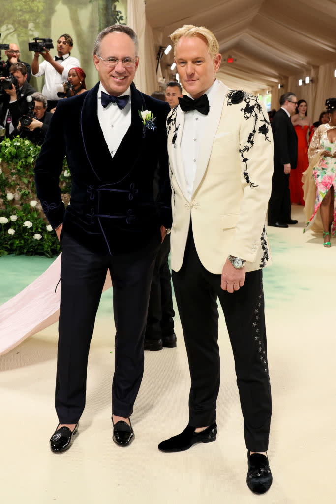 Andrew and Benedict in contrasting suits with floral details