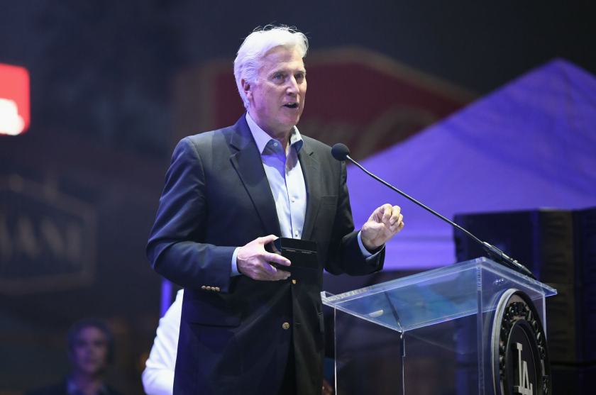 Dodgers owner Mark Walter speaks at a gala.