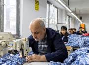 Employees work at a textile factory in Istanbul