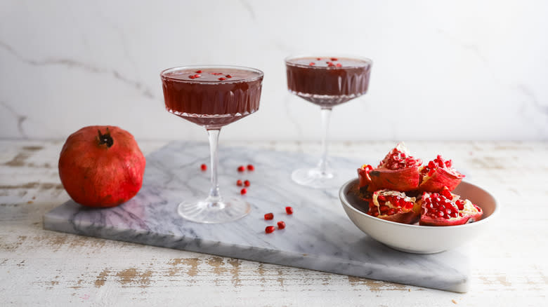 Two pomegranate fizz cocktails