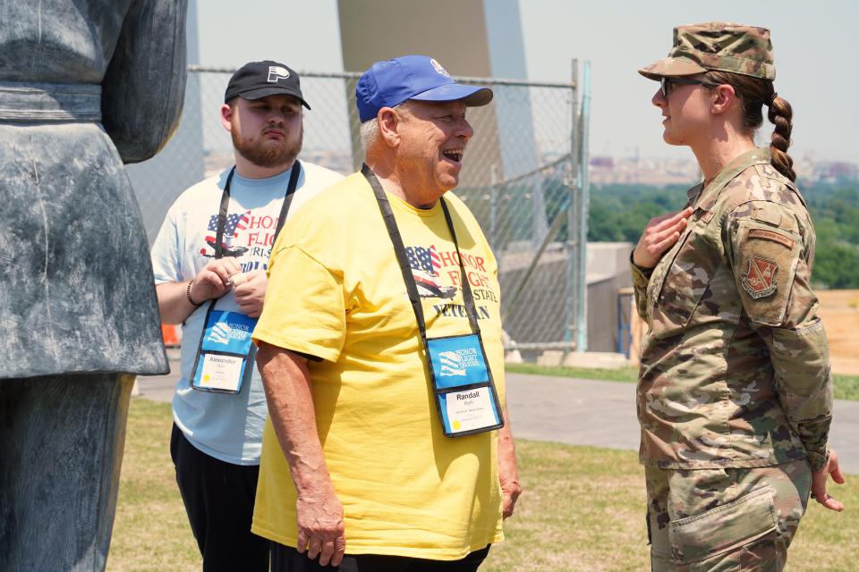 Air Force veteran Randall Roth speaks with Air Force Master Sergeant Tiffany Davis at the U.S. Air Force Memorial.