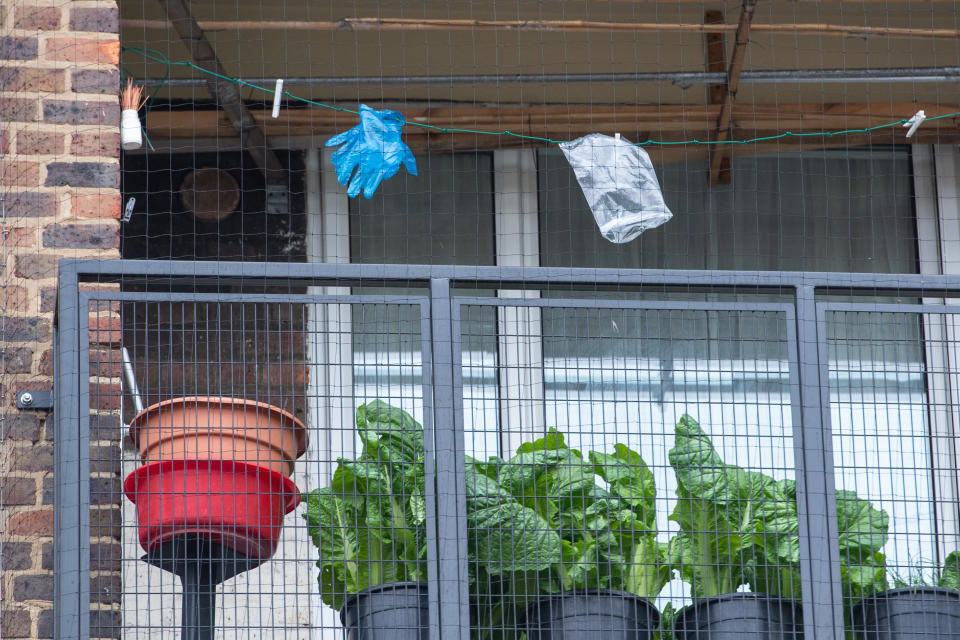 Disposable gloves pegged on a washing line in south London, as the UK continues in lockdown to help curb the spread of coronavirus.