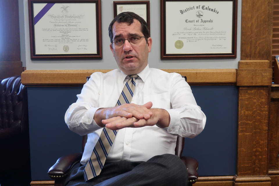 FILE - In this Thursday, July 23, 2020 file photo, Kansas Attorney General Derek Schmidt speaks during an interview in his office in Topeka, Kan. Schmidt, first elected in 2010, is running for Kansas governor in 2022. (AP Photo/John Hanna, File)