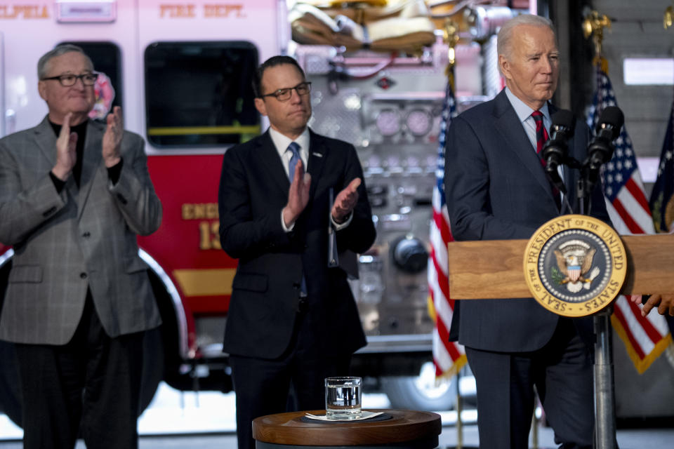 President Joe Biden, accompanied by Philadelphia Mayor Jim Kenney, left, and Pennsylvania Gov. Josh Shapiro, second from left, takes the lectern to speak at Engine 13 in Philadelphia, Monday, Dec. 11, 2023, for an event recognizing that the city of Philadelphia is receiving a 22.4 million dollar SAFER Grant, that enables the Philadelphia Fire Department to reopen three fire companies. (AP Photo/Andrew Harnik)