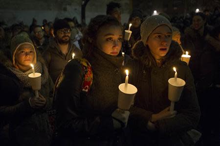 Mourners participate in a candle light vigil for late actor Phillip Seymour Hoffman in the Manhattan borough of New York February 5, 2014. Although Hoffman was found with a syringe in his arm, the cause of his death remained undetermined and more study was needed, said Julie Bolcer, a spokeswoman for New York City's Chief Medical Examiner. REUTERS/Keith Bedford