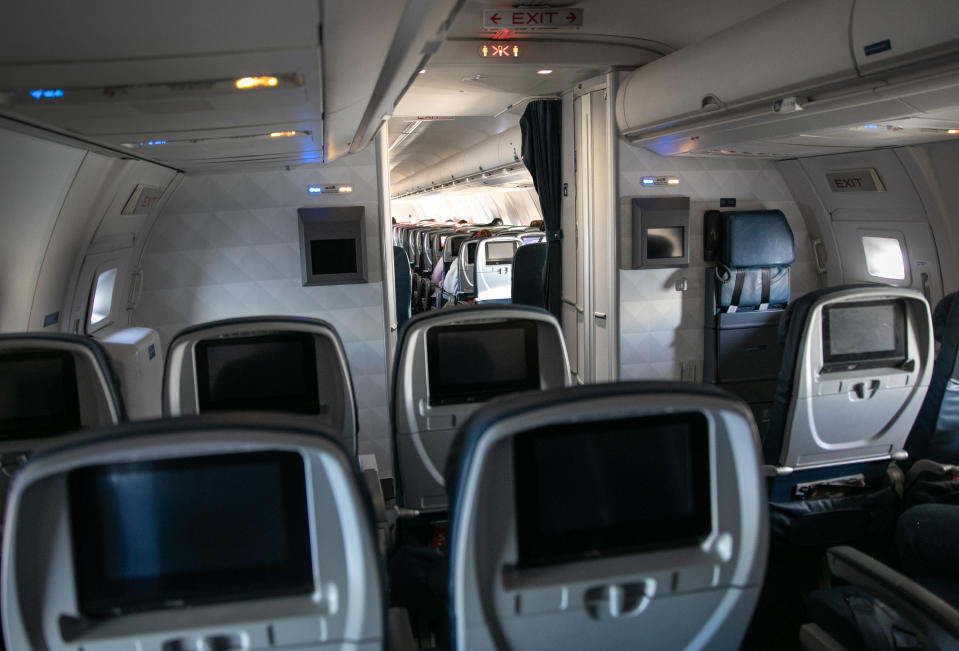 NEW YORK, NY  - MARCH 15: A Delta flight from Seattle-Tacoma International Airport flies nearly empty to JFK on March 15, 2020 near New York City. The state of Washington has over 600 confirmed cases of coronavirus (COVID-19) and U.S. airports have been crushed with returning citizens after restrictions on travel from Europe were implemented.  (Photo by John Moore/Getty Images)