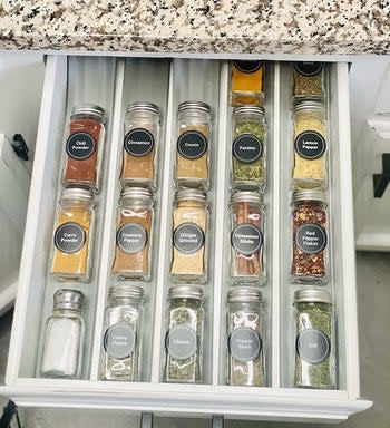 reviewer's spice jars organized on the gray liner